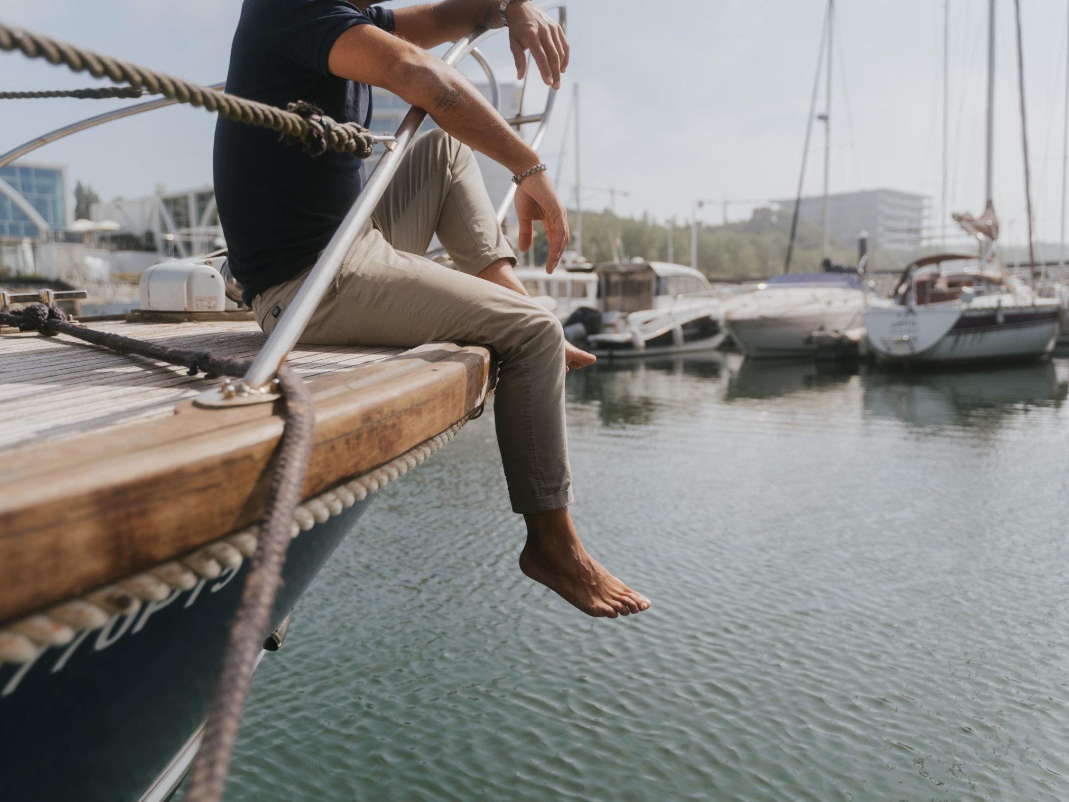 a man riding on the back of a boat douro marina