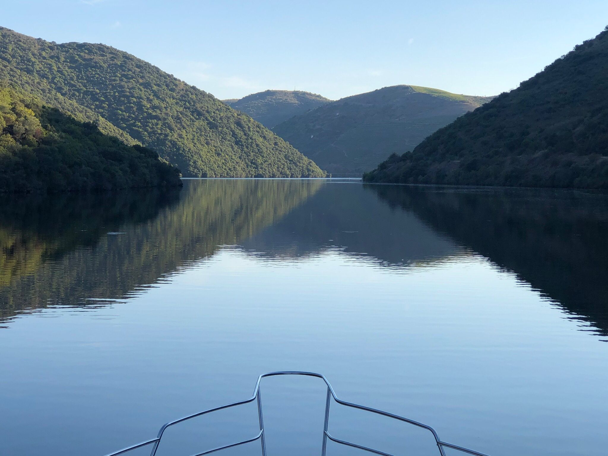 a body of water with a mountain in the background