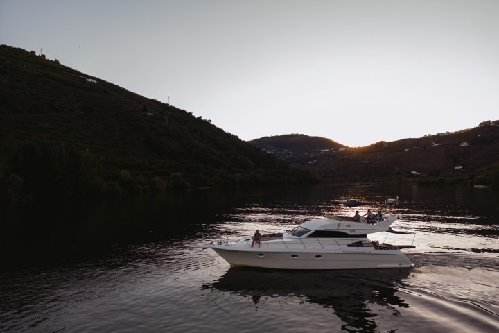 a body of water with a mountain in the background