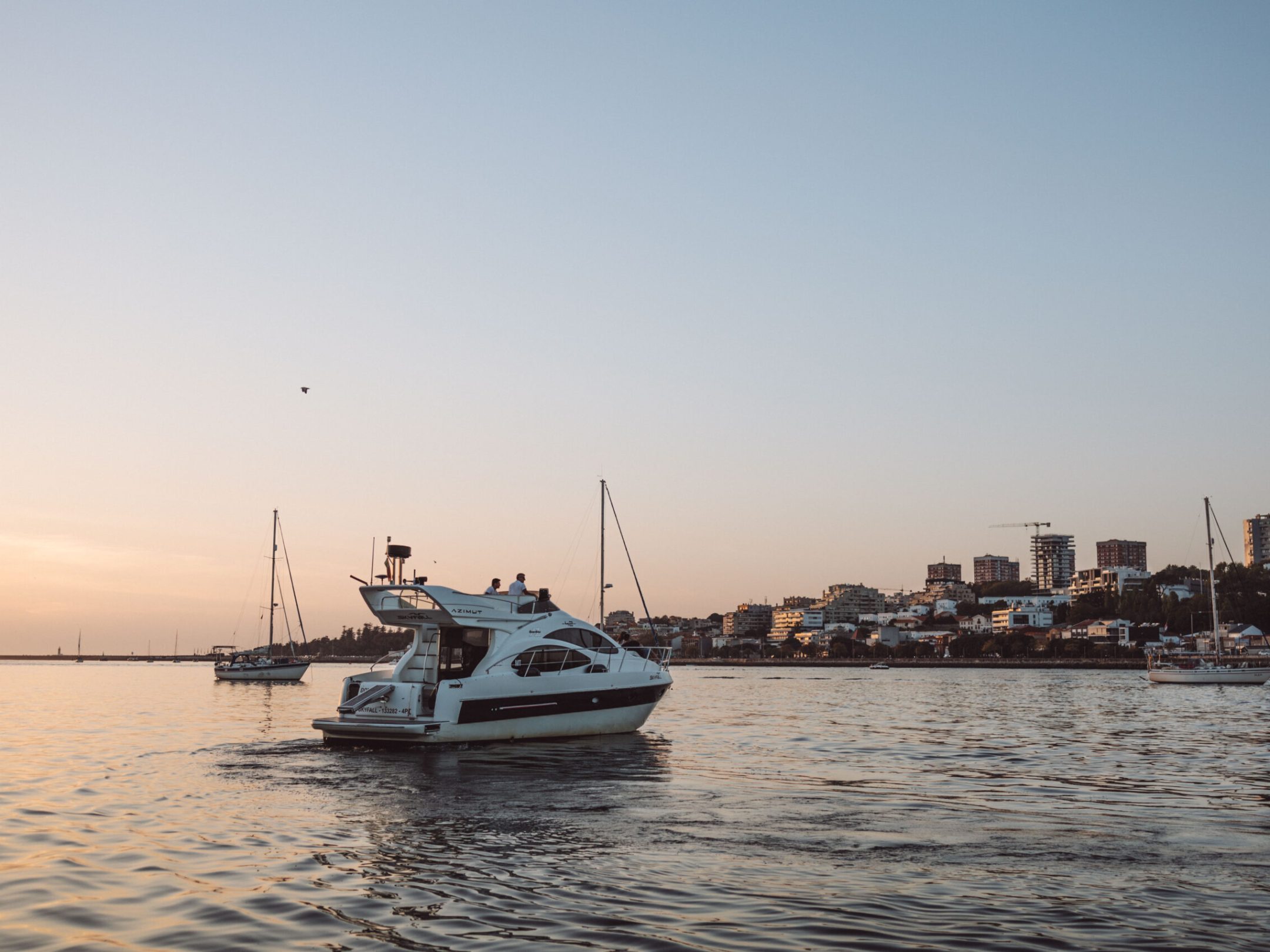 a boat is docked next to a body of water