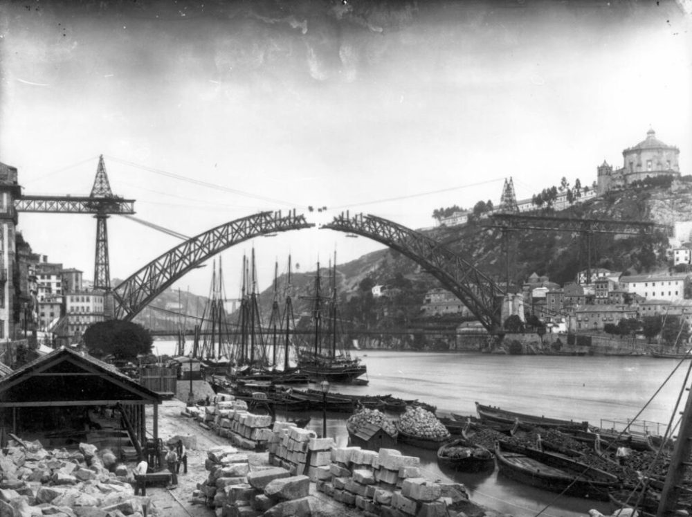 a train crossing a bridge over a river